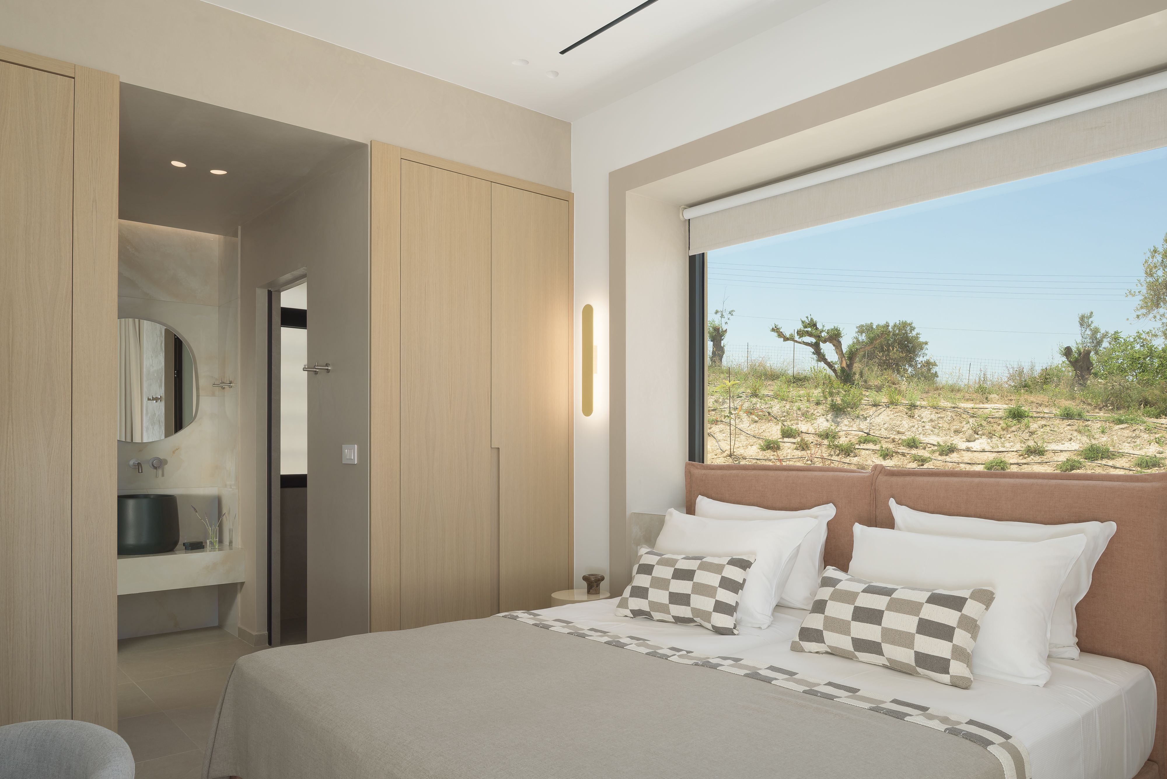 Twin bedroom featuring a sublime en-suite bathroom with walk in shower.