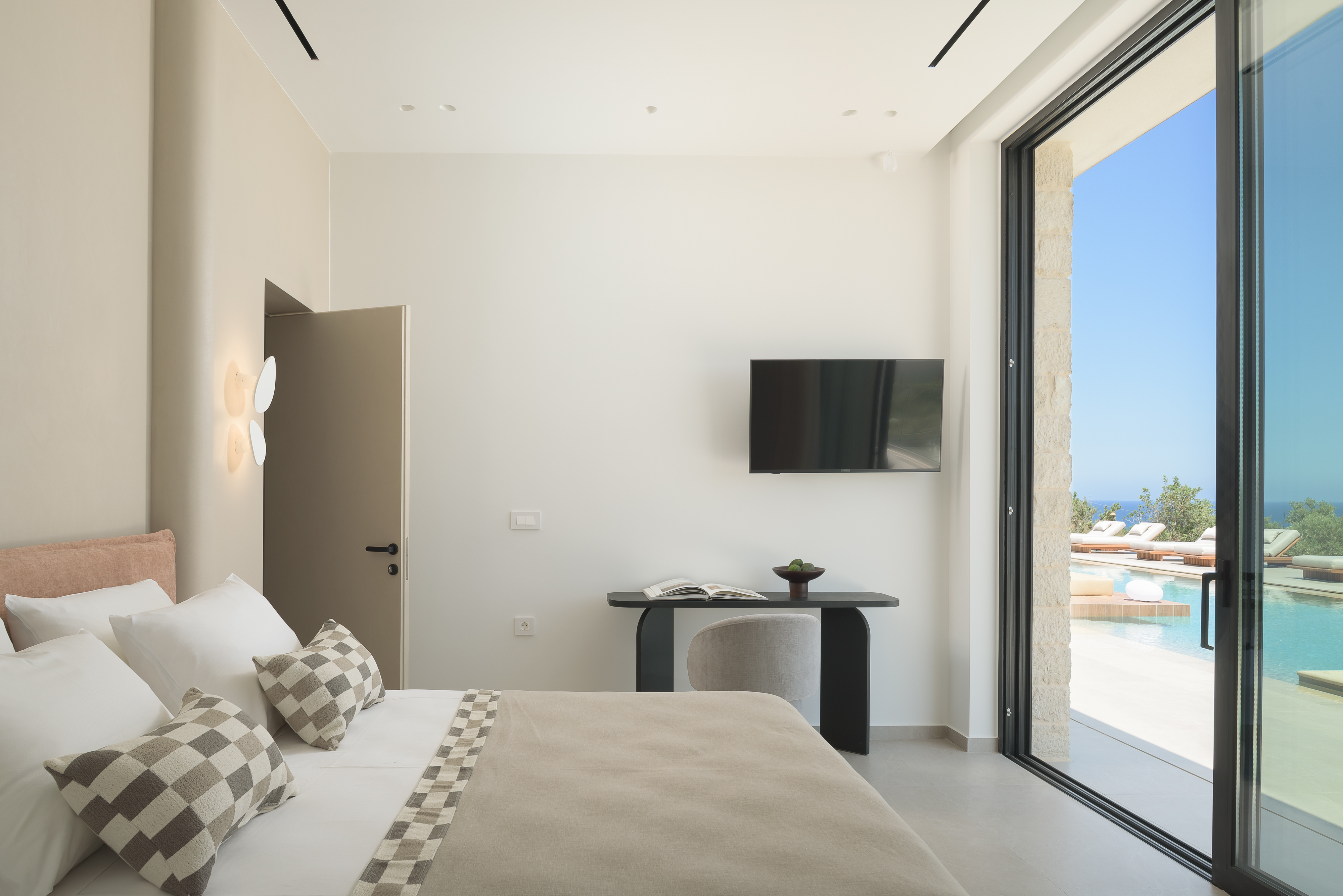 Designed for restorative sleep, this bedroom offers direct pool access and a 42' Smart TV.