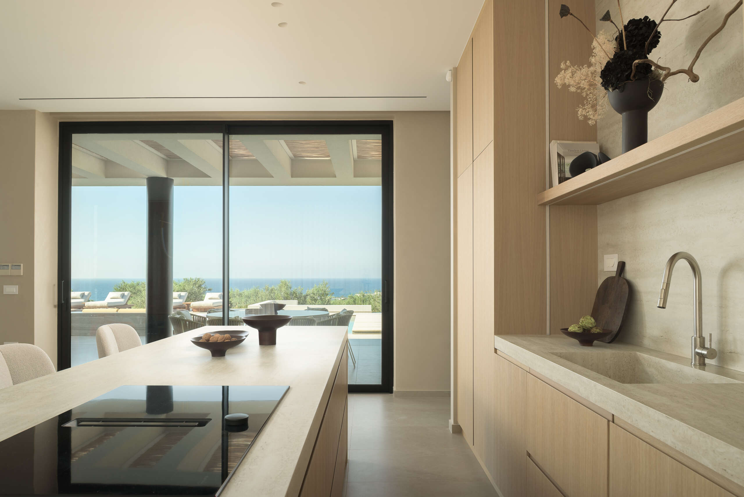 Opening naturally to the pool area, the kitchen invites slow breakfasts, relaxed cooking, and easy conversation. Opening naturally to the pool area, the kitchen invites slow breakfasts, relaxed cooking, and easy conversation.