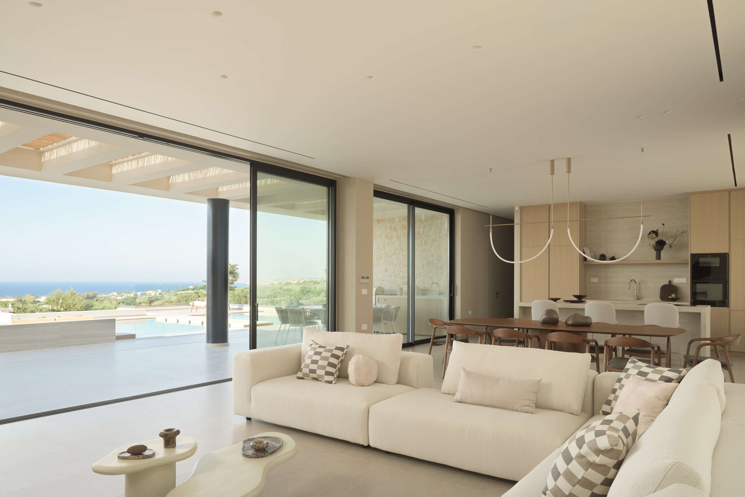 The living room & kitchen carries the villa’s earth-led spirit indoors. The living room & kitchen carries the villa’s earth-led spirit indoors.